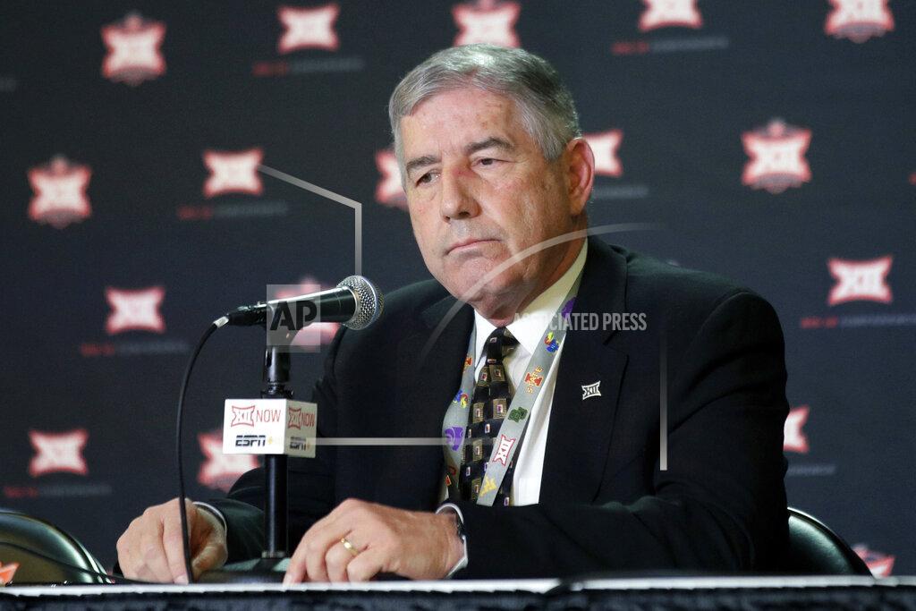 Orlin Wagner FILE - In this March 11, 2020, file photo, Big 12 Commissioner Bob Bowlsby announces no fans will be admitted to the rest of the Big 12 basketball tournament in Kansas City, Kan. As virus disruptions mount and the Dec. 19 end of college football's regular season draws closer, the possibility grows that conference championships, major awards and even College Football Playoff participants will be determined by COVID-19. “If you’d asked me in July if we’d have gotten this many games in, I wouldn’t have wanted to bet a lot of money on it,” Big 12 Commissioner Bob Bowlsby said. (AP Photo/Orlin Wagner, File)
