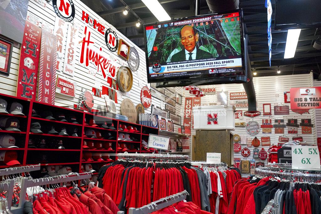 Nati Harnik A television is tuned to the Big Ten network as Nebraska merchandise is offered for sale at the Husker Hounds store in Omaha, Neb., Wednesday, Aug. 12, 2020. The Big Ten conference announced on Tuesday, Aug. 11, 2020, they won't play football this fall because of concerns about COVID-19, becoming the first of college sports' power conferences to yield to the pandemic. (AP Photo/Nati Harnik)