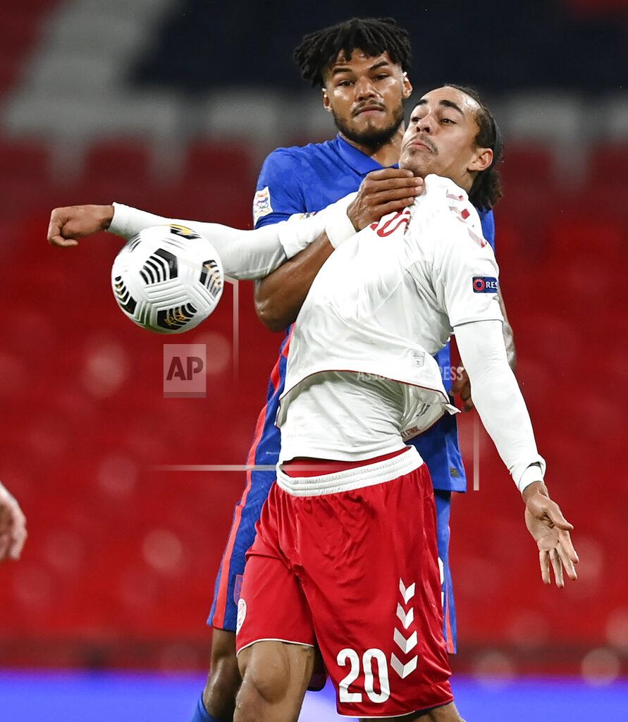 England's Tyrone Mings and Denmark's Yussuf Poulsen battle for the ball during the UEFA Nations League soccer match between England and Denmark at Wembley Stadium in London, England, Wednesday, Oct. 14, 2020. (Daniel Leal-Olivas/Pool via AP)