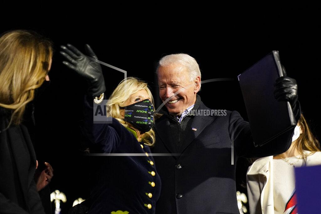 Andrew Harnik Democratic presidential candidate former Vice President Joe Biden stands with his wife Jill Biden and his grandchildren during a drive-in rally at Heinz Field, Monday, Nov. 2, 2020, in Pittsburgh. (AP Photo/Andrew Harnik)