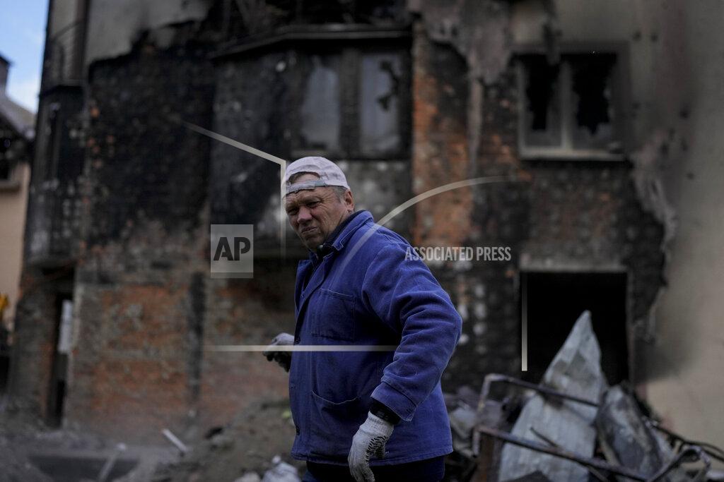 Natacha Pisarenko Anatolii Chovpin stands outside the damagde building where he lives ruined by attacks in Irpin, on the outskirts of Kyiv, Ukraine, Thursday, May 26, 2022. (AP Photo/Natacha Pisarenko)