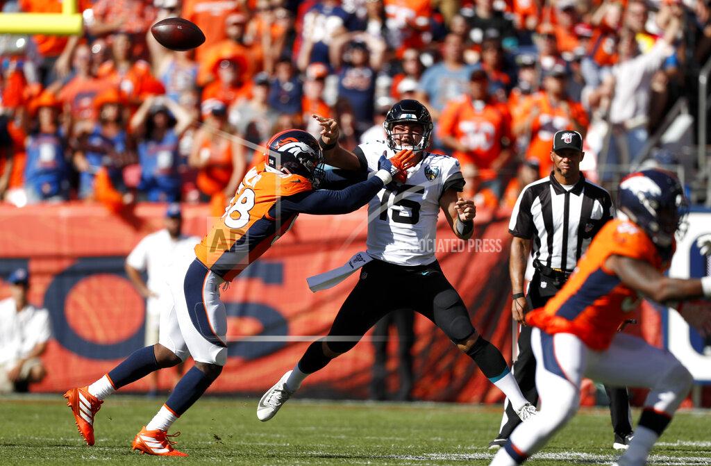 David Zalubowski FILE - In this Sept. 29, 2019, file photo, Jacksonville Jaguars quarterback Gardner Minshew (15) throws a pass under pressure from Denver Broncos outside linebacker Von Miller, left, during the first half of an NFL football game in Denver. Denver has lost both home games on last-second field goals. ... One way to turn that around would be for star linebacker Miller to start getting to quarterbacks. Miller has 10½ sacks in his last 10 home games but just two sacks this season. (AP Photo/David Zalubowski, File)