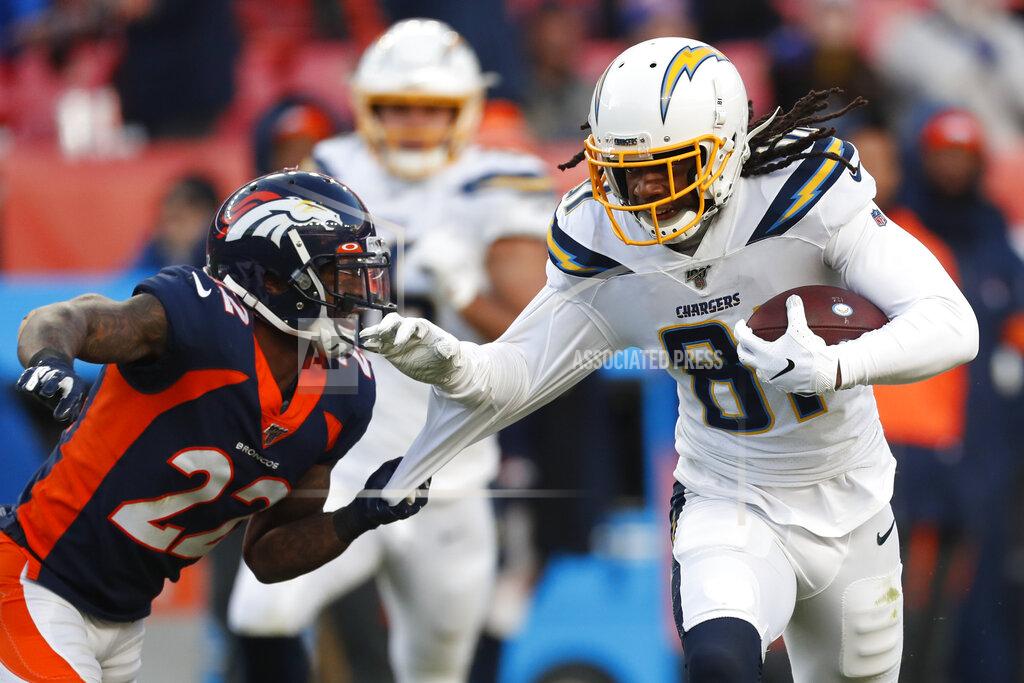David Zalubowski Los Angeles Chargers wide receiver Mike Williams, right, is tackled by Denver Broncos strong safety Kareem Jackson during the first half of an NFL football game Sunday, Dec. 1, 2019, in Denver. (AP Photo/David Zalubowski)
