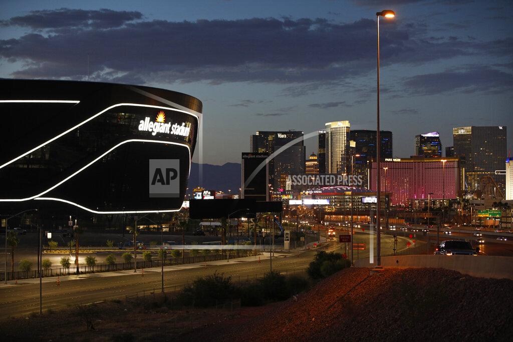 John Locher Lights adorn Allegiant Stadium, new home of the Las Vegas Raiders football team, as it nears completion Wednesday, July 22, 2020, in Las Vegas. The stadium will also serve as the home for the UNLV football team. (AP Photo/John Locher)