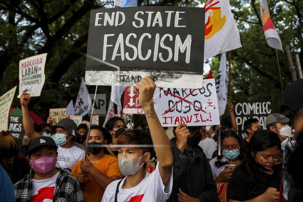 Basilio Sepe Activists protest against presidential frontrunner Ferdinand "Bongbong" Marcos and running mate Sara Duterte, daughter of the current president, during a rally at the Commission on Human Rights in Quezon City, Metro Manila, Philippines on Wednesday. May 25, 2022. Marcos Jr. continues to lead in the official canvassing of votes. (AP Photo/Basilio Sepe)