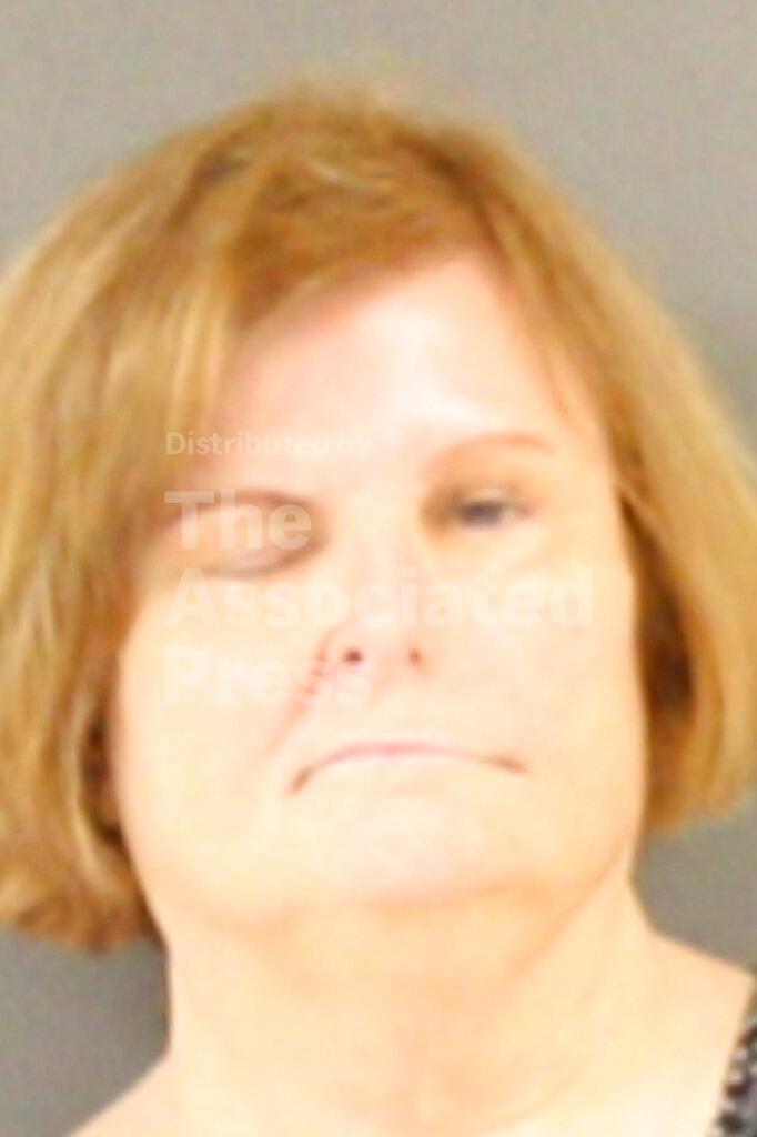 This Wednesday, Feb. 5, 2020, Hinds County Detention Center booking photograph shows Anne McGrew, an accountant for the Mississippi Community Education Center, in Raymond, Miss. McGrew and five other people were indicted and arrested for allegedly embezzling millions in federal money meant for the poor through an investigation by the Mississippi State Auditor's office. (Hinds County Detention Center via AP)
