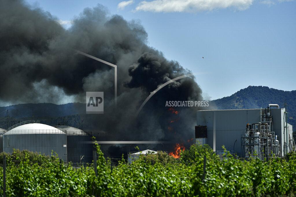 Alvaro Barrientos Black smoke billows from a biodiesel production plant in Calahorra, northern Spain, Thursday, May 26, 2022. Police in Spain say an explosion at a biodiesel plant has left two people dead and forced 250 children to be evacuated from the area. (AP Photo/Alvaro Barrientos)