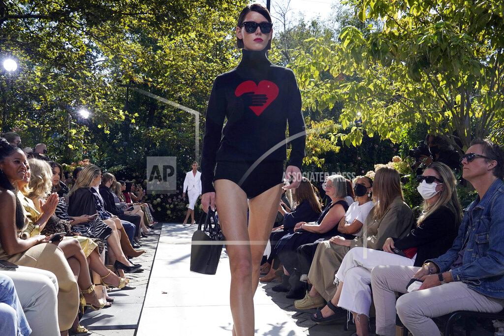 Richard Drew The Michael Kors Spring/Summer 2022 collection is modeled during Fashion Week, in New York, Friday, Sept. 10, 2021. (AP Photo/Richard Drew)