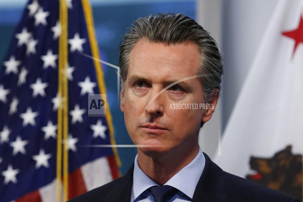 FILE - In this April 9, 2020, file photo, California Gov. Gavin Newsom listens to a reporter's question during his daily news briefing in Rancho Cordova, Calif. California's major deal for hundreds of millions of N95 respirator masks hit a delay in its federal certification process, Gov. Gavin Newsom said Wednesday, May 6, 2020, as he promised details of the contract would soon be made public. (AP Photo/Rich Pedroncelli, Pool)