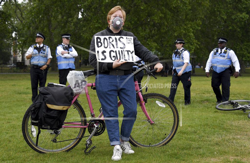 Alberto Pezzali A protestor rests on his bicycle during protests in London, Friday, June 12, 2020 in response to the recent killing of George Floyd by police officers in Minneapolis, USA, that has led to protests in many countries and across the US.(AP Photo/Alberto Pezzali)