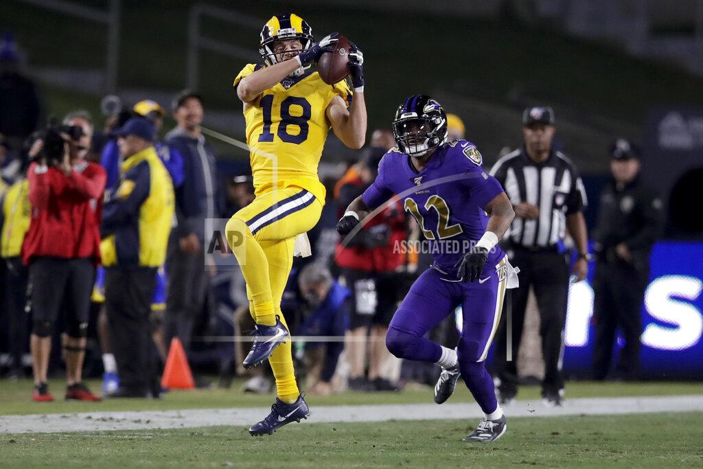 Los Angeles Rams wide receiver Cooper Kupp catches a pass in front of Baltimore Ravens cornerback Jimmy Smith during the second half of an NFL football game Monday, Nov. 25, 2019, in Los Angeles. (AP Photo/Marcio Jose Sanchez)