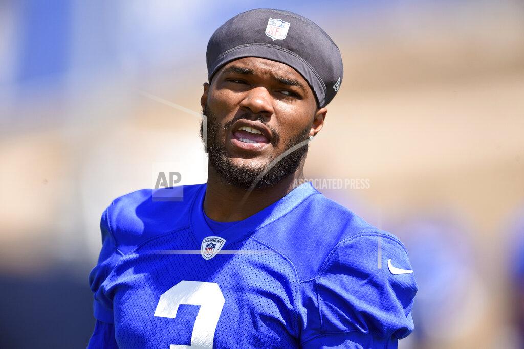 FILE - In this May 27, 2021, file photo, Los Angeles Rams' Cam Akers warms up during NFL football practice in Thousand Oaks, Calif. Akers is out indefinitely after tearing his Achilles tendon in an offseason training session. The Rams confirmed the injury Tuesday, July 20, 2021, one week before veterans report to training camp. (AP Photo/Kelvin Kuo, File)