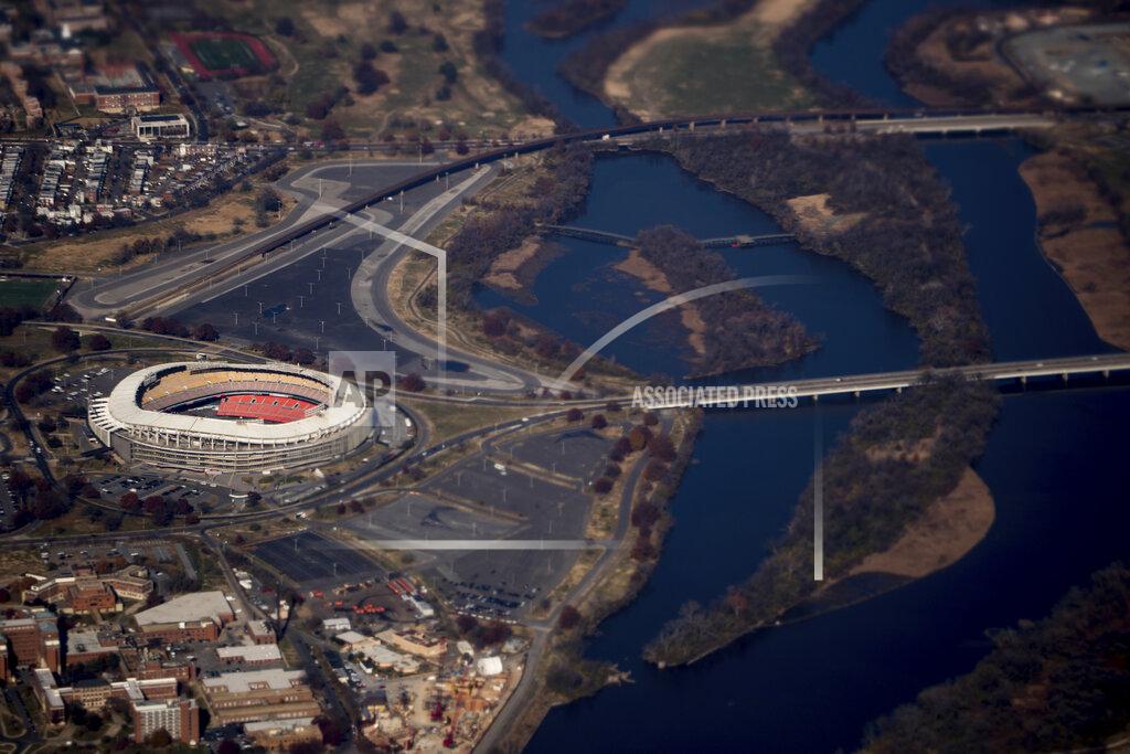Andrew Harnik In this Nov. 29, 2017 photo RFK Stadium is visible from Air Force One as it takes off from Andrews Air Force Base, Md. FedEx Field is a concrete relic of stadiums past with a clock ticking on its status as an NFL building. The Washington Redskins’ training camp home away from home is only six years old and yet it appears to be on borrowed time. (AP Photo/Andrew Harnik)