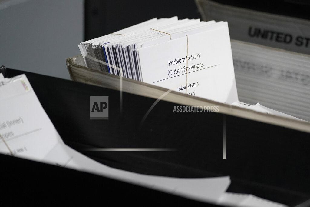 Keith Srakocic A bundle of mail-in ballots marked "Problem Return, (Outer) Envelopes" are set aside as election workers continue counting ballots for the Pennsylvania primary election, Wednesday, May 18, 2022, at the Mercer County Elections Board in Mercer, Pa. Vote counting continues as Republican candidates Dr. Mehmet Oz and David McCormick are locked in a too-early-to-call race for Pennsylvania's hotly contested Republican nomination for an open U.S. Senate seat. (AP Photo/Keith Srakocic)