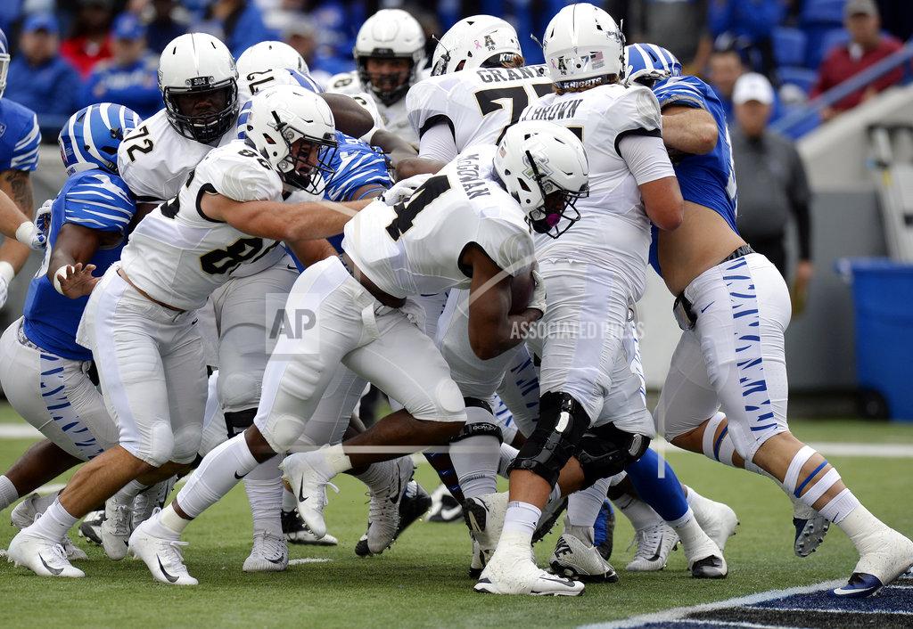 Mark Zaleski Central Florida running back Taj McGowan (4) scores a touchdown on a 2-yard run against Memphis during the first half of an NCAA college football game Saturday, Oct. 13, 2018, in Memphis, Tenn. (AP Photo/Mark Zaleski)