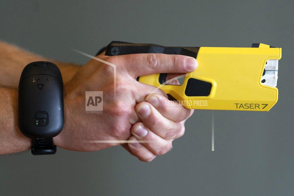 Jacquelyn Martin VR equipment and a version of the TASER 7 that utilizes VR technology for training, is demonstrated, Thursday, May 12, 2022, in Washington. Axon, the company that is best known for developing the Taser, is expanding virtual reality and immersive training in an effort to encourage police officers across the U.S. to more regularly train with less-than-lethal weapons. (AP Photo/Jacquelyn Martin)