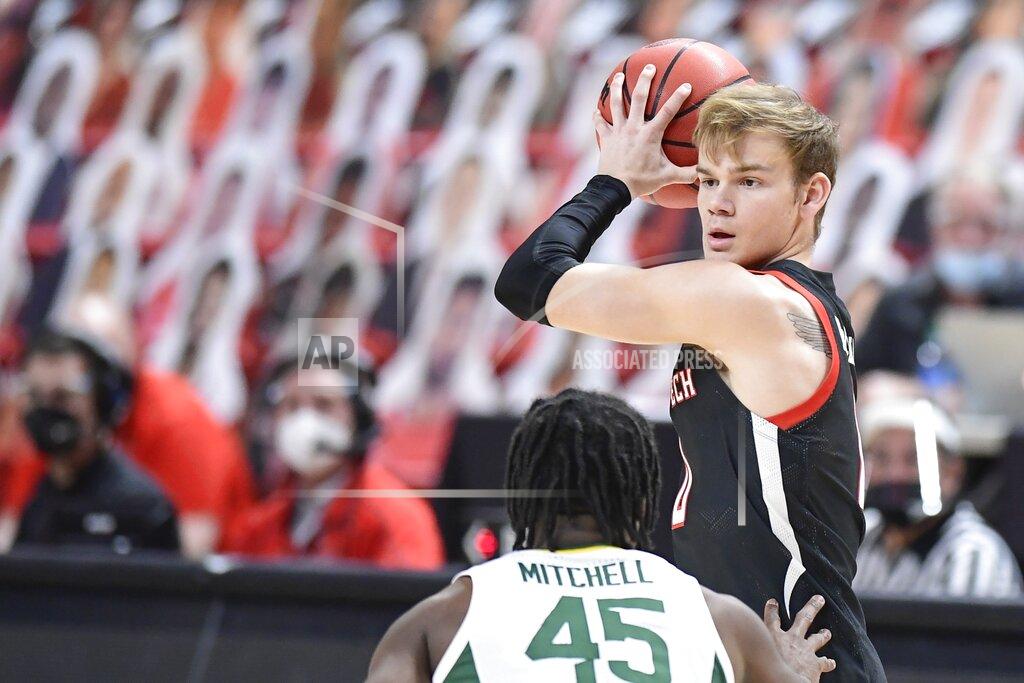 Justin Rex Texas Tech's Mac McClung (0) controls the ball during the first half of an NCAA college basketball game against Baylor in Lubbock, Texas, Saturday, Jan. 16, 2021. (AP Photo/Justin Rex)
