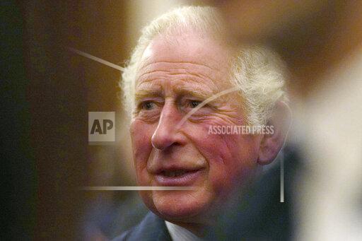 FILE - In this Oct. 19, 2021 file photo, Britain's Prince Charles greets guests at a reception for the Global Investment Summit in Windsor Castle, Windsor, England. Prince Charles issued a warning to the world days before leaders gather in the U.K. for crucial United Nations climate talks, saying there is a “dangerously narrow” window to tackle global warning. (AP Photo/Alastair Grant, Pool)