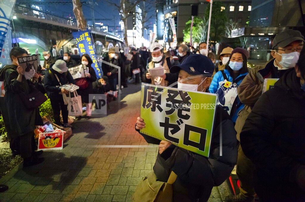 Hiro Komae Members of anti-nuclear plant groups and their supporters participate in a protest across from the Tokyo Electric Power Co. headquarters in Tokyo on Thursday, March 11, 2021. The placard reads, "Zero nuclear power plant." An earthquake 10-years ago, set off a tsunami and nuclear crisis that devastated the country’s northeast coast. (AP Photo/Hiro Komae)