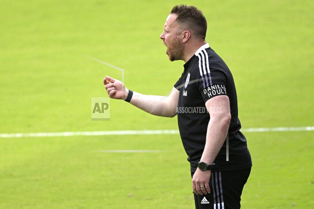 Phelan M. Ebenhack Vancouver Whitecaps head coach Marc Dos Santos calls out instructions during the first half of an MLS soccer match against Toronto FC, Saturday, April 24, 2021, in Orlando, Fla. (AP Photo/Phelan M. Ebenhack)