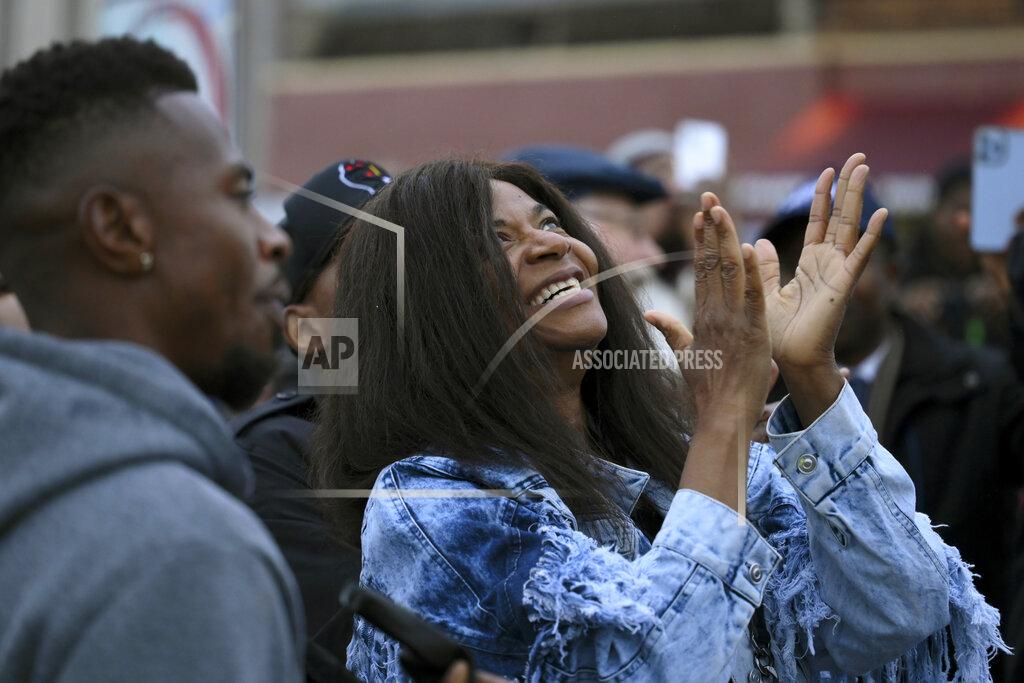 Aaron Lavinsky Angela Harrelson, aunt of George Floyd, reacts after the unveiling of a George Perry Floyd sign Wednesday, May 25, 2022, in Minneapolis. The intersection where Floyd died at the hands of Minneapolis police officers was renamed in his honor Wednesday, among a series of events to remember a man whose killing forced America to confront racial injustice. (Aaron Lavinsky/Star Tribune via AP)