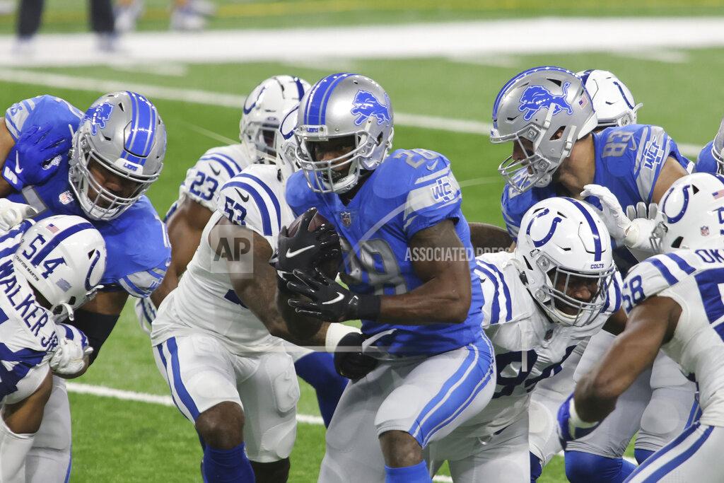 Tony Ding Detroit Lions running back Adrian Peterson rushes during the first half of an NFL football game against the Indianapolis Colts, Sunday, Nov. 1, 2020, in Detroit. (AP Photo/Tony Ding)