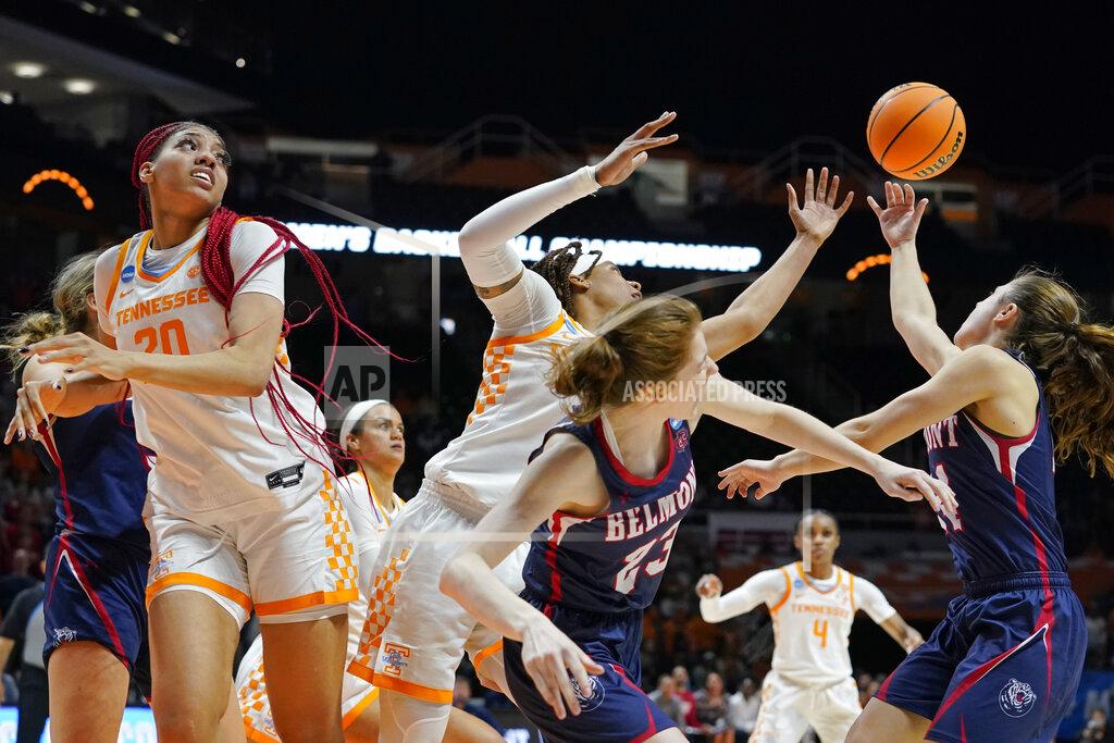Mark Humphrey Tennessee and Belmont players battle for a rebound in the second half of a women's college basketball game in the second round of the NCAA tournament Monday, March 21, 2022, in Knoxville, Tenn. Tennessee won 70-67. (AP Photo/Mark Humphrey)