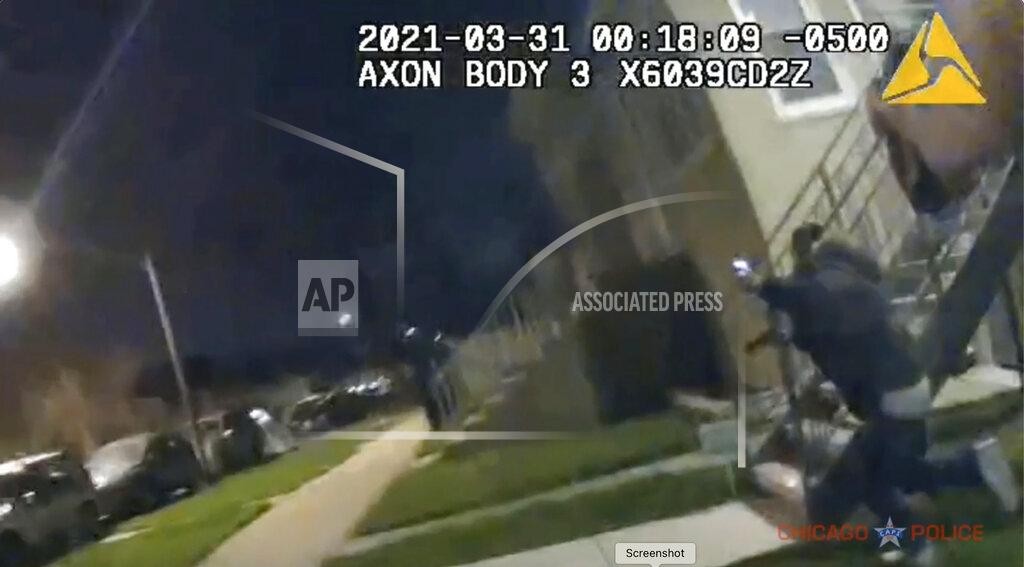 Uncredited In this image taken from Chicago Police body cam video from early Wednesday, March 31, 2021, Anthony Alvarez, right, runs away during a police foot chase in Chicago. Alvarez was fatally shot by police during the incident. Police claim Alvarez, 22, brandished a gun while being chased. (Civilian Office of Police Accountability via AP)