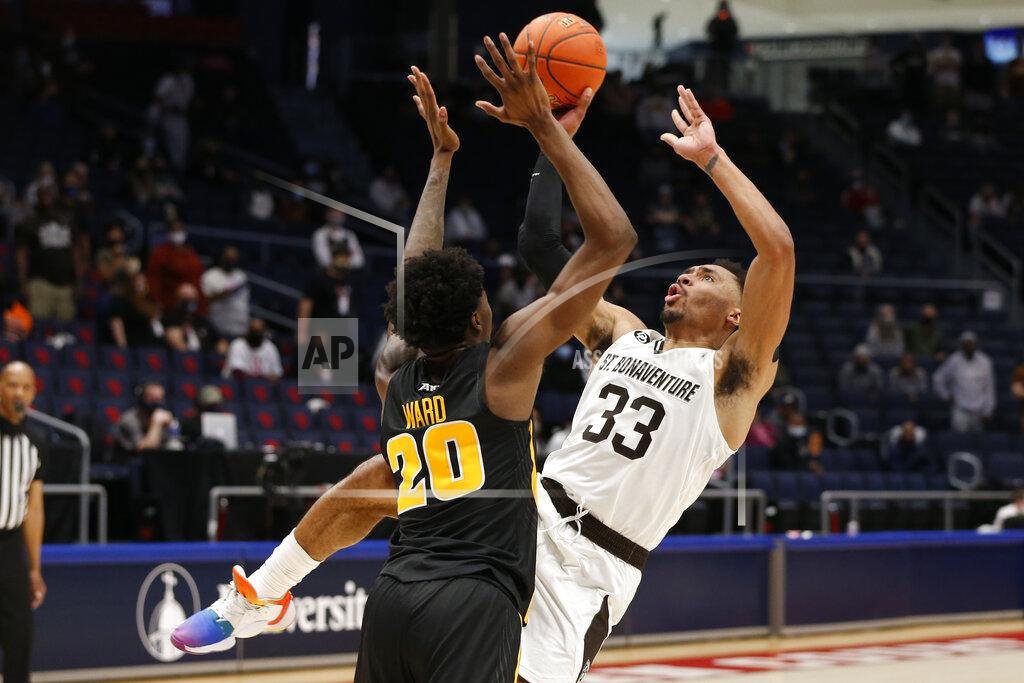 Jay Laprete FILE - St. Bonaventure's Jalen Adaway, right, tries to shoot over VCU's Hason Ward during the first half of an NCAA college basketball championship game for the Atlantic Ten Conference tournament Sunday, March 14, 2021, in Dayton, Ohio. No. 23 St. Bonaventure is ranked for the first time in 50 years and returns five seniors -- all starters -- from the team which went 16-5 and lost to eight-seeded LSU in the first round of the NCAA Tournament last year.(AP Photo/Jay LaPrete, File)