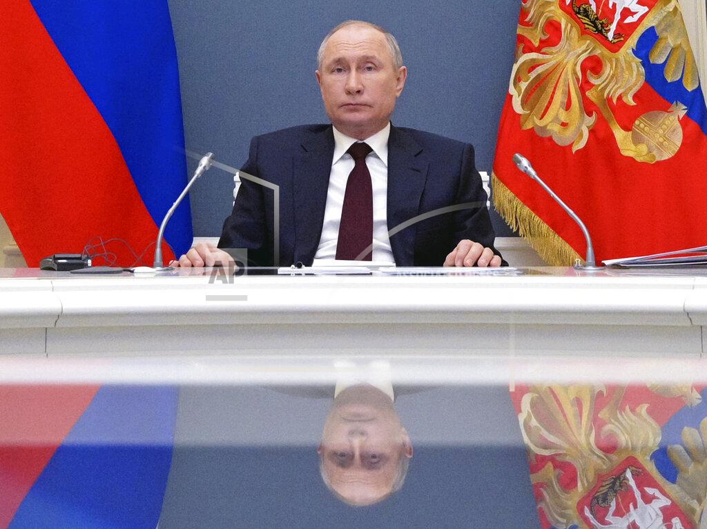 Russian President Vladimir Putin attends the virtual Leaders Summit on Climate in Moscow, Russia, Thursday, April 22, 2021. (Alexei Druzhinin, Sputnik, Kremlin Pool Photo via AP)