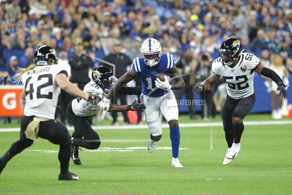 Aj Mast Indianapolis Colts wide receiver Zach Pascal (14) is tackled by Jacksonville Jaguars' Jarrod Wilson (26) during the first half of an NFL football game, Sunday, Nov. 17, 2019, in Indianapolis. (AP Photo/AJ Mast)