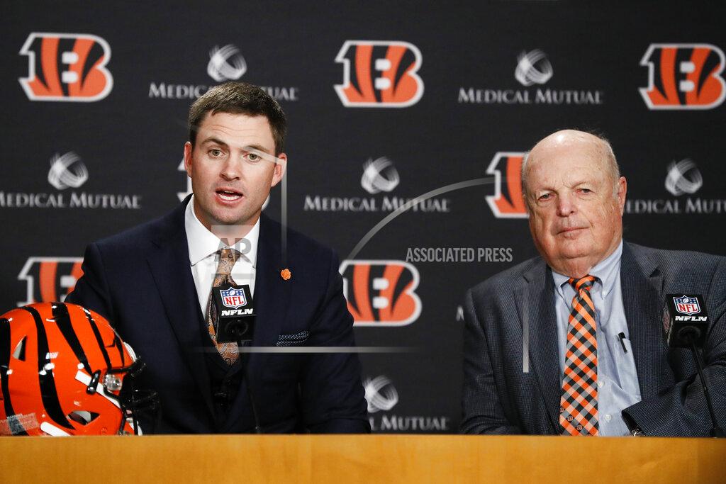 John Minchillo Cincinnati Bengals football head coach Zac Taylor, left, speaks alongside Bengals owner Mike Brown, right, during a news conference, Tuesday, Feb. 5, 2019, in Cincinnati. After 16 years without a playoff win under Marvin Lewis, the Bengals decided to try something different. But they had to wait more than a month before hiring Zac Taylor as their next coach in hopes of ending a long streak of futility. (AP Photo/John Minchillo)