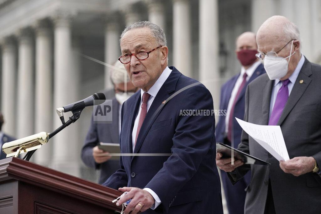 J. Scott Applewhite Senate Minority Leader Chuck Schumer, D-N.Y., and Democratic members of the Senate Judiciary Committee hold a news conference after boycotting the vote by the Republican-led panel to advance the nomination of Judge Amy Coney Barrett to sit on the Supreme Court, Thursday, Oct. 22, 2020, at the Capitol in Washington. (AP Photo/J. Scott Applewhite)