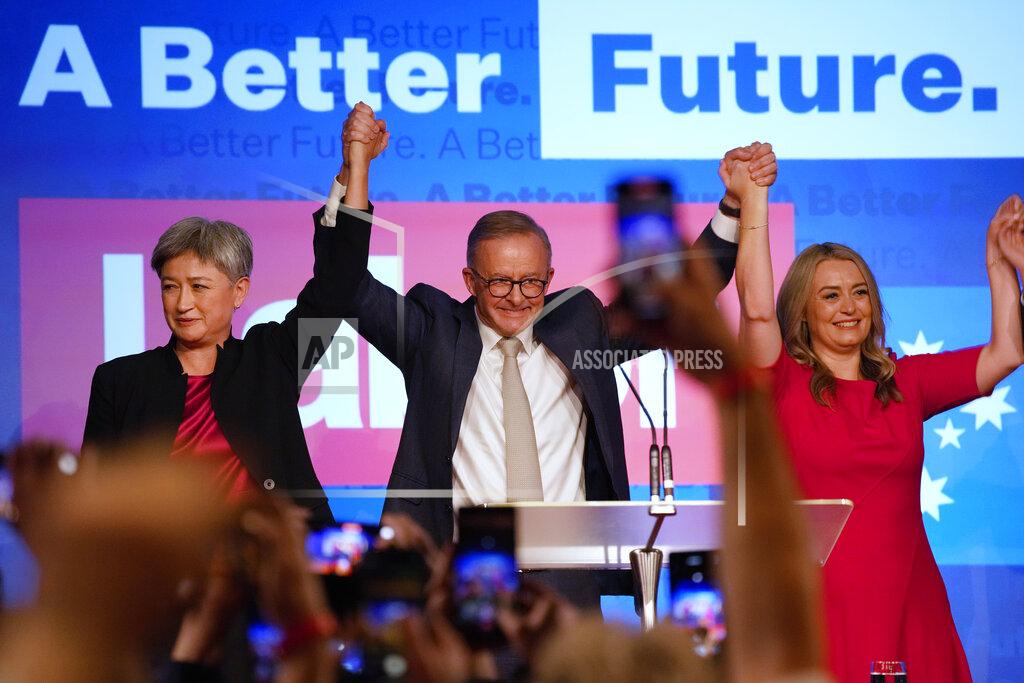 Rick Rycroft Labor Party leader Anthony Albanese, center back, celebrates with his partner partner Jodie Haydon, right, and Labor senate leader partner Penny Wong at a Labor Party event in Sydney, Australia, Sunday, May 22, 2022, after Prime Minister Scott Morrison conceding defeat to Albanese in a federal election. (AP Photo/Rick Rycroft)