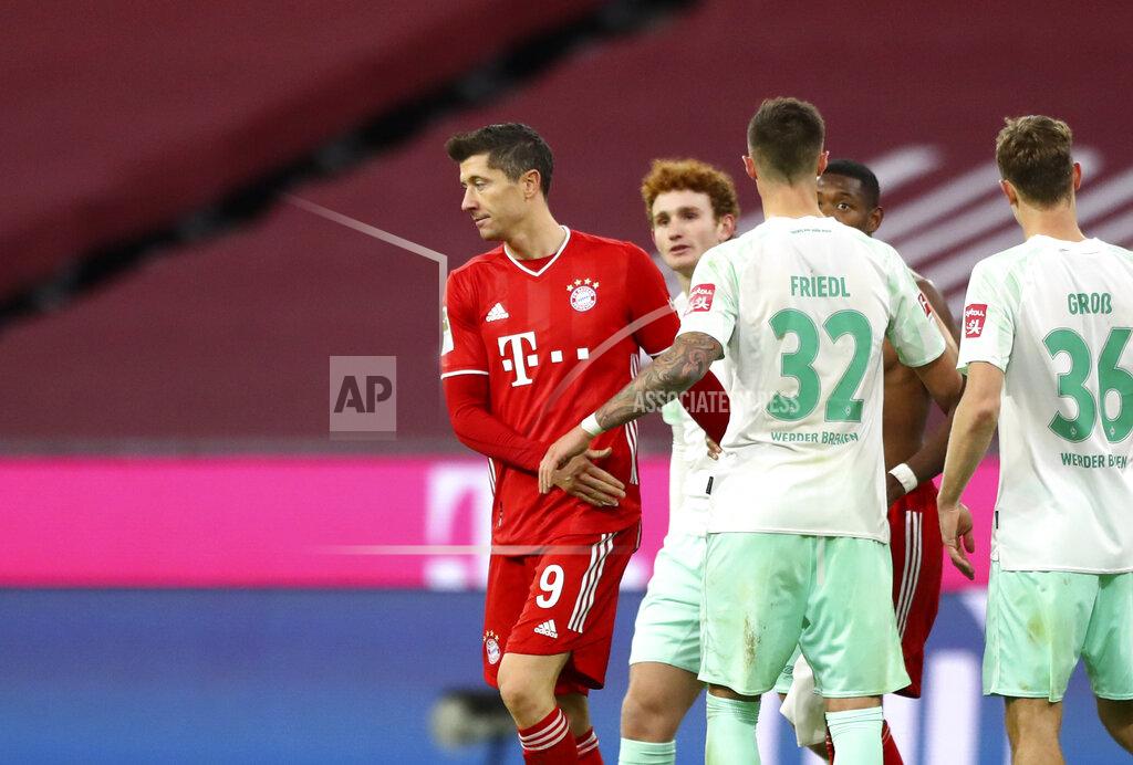Matthias Schrader Bayern's Robert Lewandowski, left, and Bremen's Marco Friedl, second left, leave the field after the German Bundesliga soccer match between FC Bayern Munich and SV Werder Bremen in Munich, Germany, Saturday, Nov. 21, 2020. (AP Photo/Matthias Schrader)