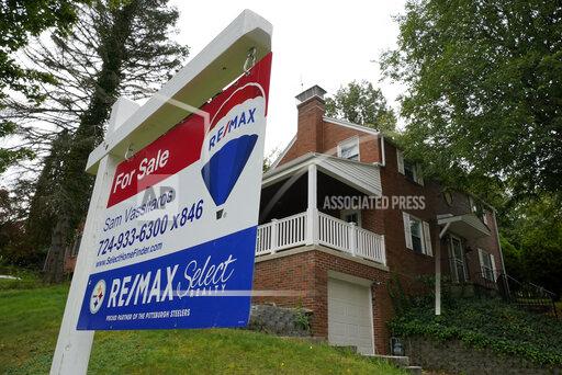 FILE - A for sale sign is displayed outside a home in Mount Lebanon, Pa., on Tuesday, Sept. 21, 2021. U.S. home prices jumped in August by a near-record amount from a year earlier, as Americans eager to buy a home drove up prices on a dwindling number of properties. (AP Photo/Gene J. Puskar, file)