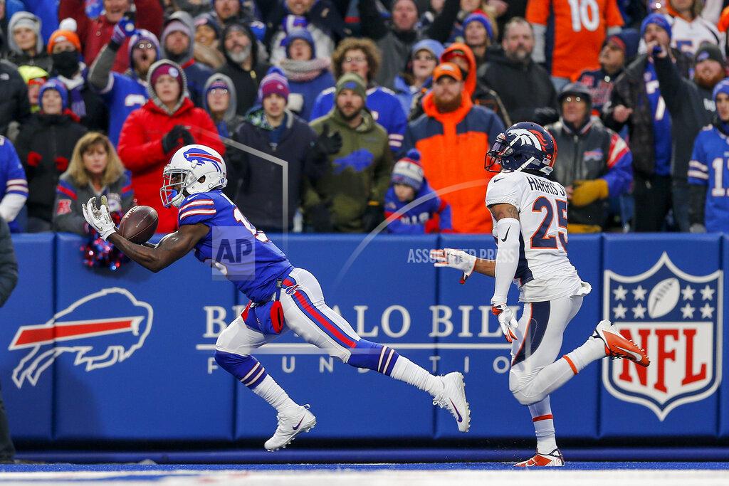 John Munson Buffalo Bills wide receiver John Brown (15) makes a diving catch for a touchdown against Denver Broncos cornerback Chris Harris (25) during the fourth quarter of an NFL football game, Sunday, Nov. 24, 2019, in Orchard Park, N.Y. (AP Photo/John Munson)