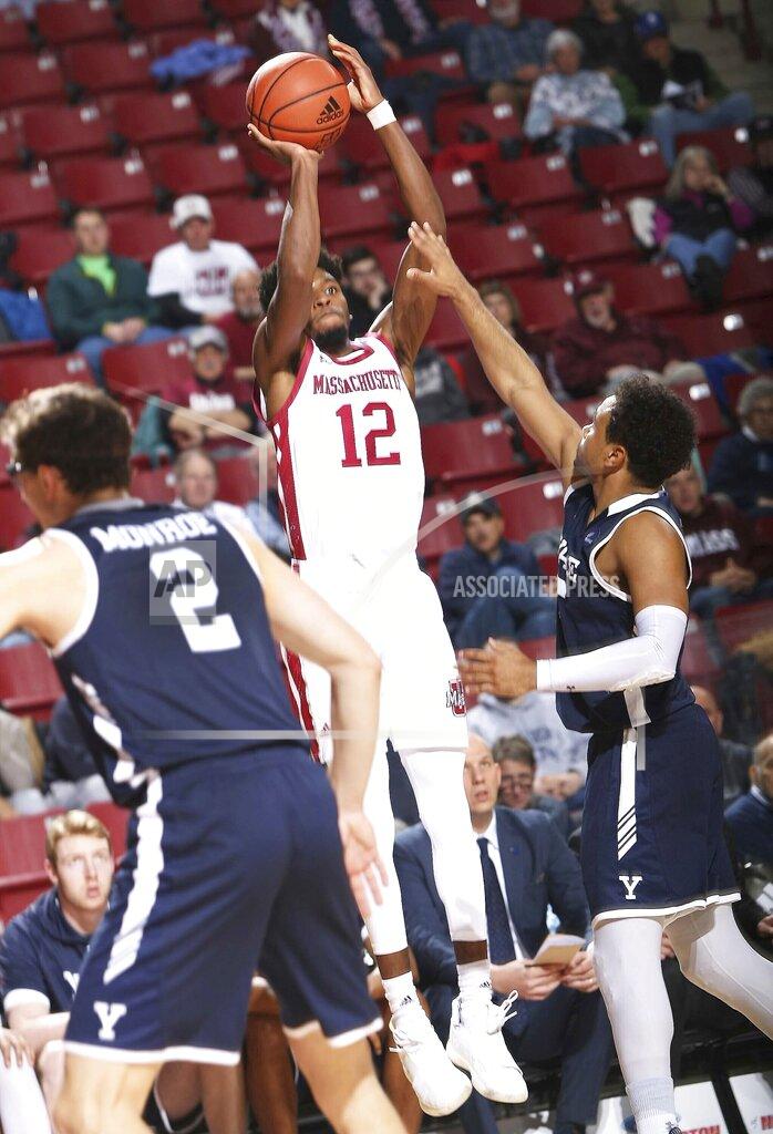 J. Anthony Roberts Massachusetts' Carl Pierre (12) launches up a 3-pointer from the corner over Yale's Azar Swian (5) during an NCAA college basketball game, Wednesday, Dec. 11, 2019 in Amherst, Mass. ( J. Anthony Roberts/The Republican via AP)