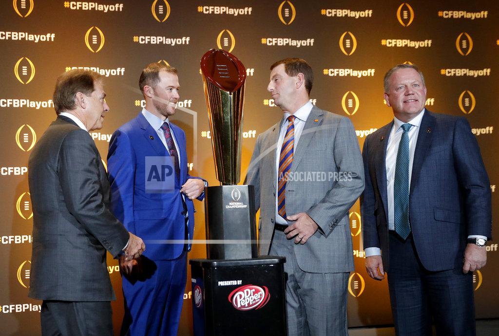 John Bazemore The coaches of the four teams in the College Football Playoff, from left, Alabama's Nick Saban, Oklahoma's Lincoln Riley, Clemson's Dabo Swinney and Notre Dame's Brian Kelly chat after a news conference Thursday, Dec. 6, 2018, in Atlanta. Alabama will face Oklahoma in the Orange Bowl and Clemson and Notre Dame will play in the Cotton Bowl. (AP Photo/John Bazemore)