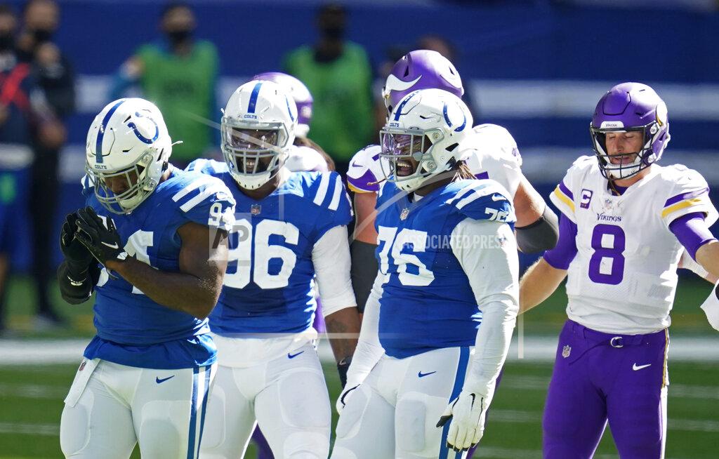 Michael Conroy Indianapolis Colts defensive end Tyquan Lewis (94) celebrates a sack of Minnesota Vikings quarterback Kirk Cousins (8) during the second half of an NFL football game, Sunday, Sept. 20, 2020, in Indianapolis. (AP Photo/Michael Conroy)