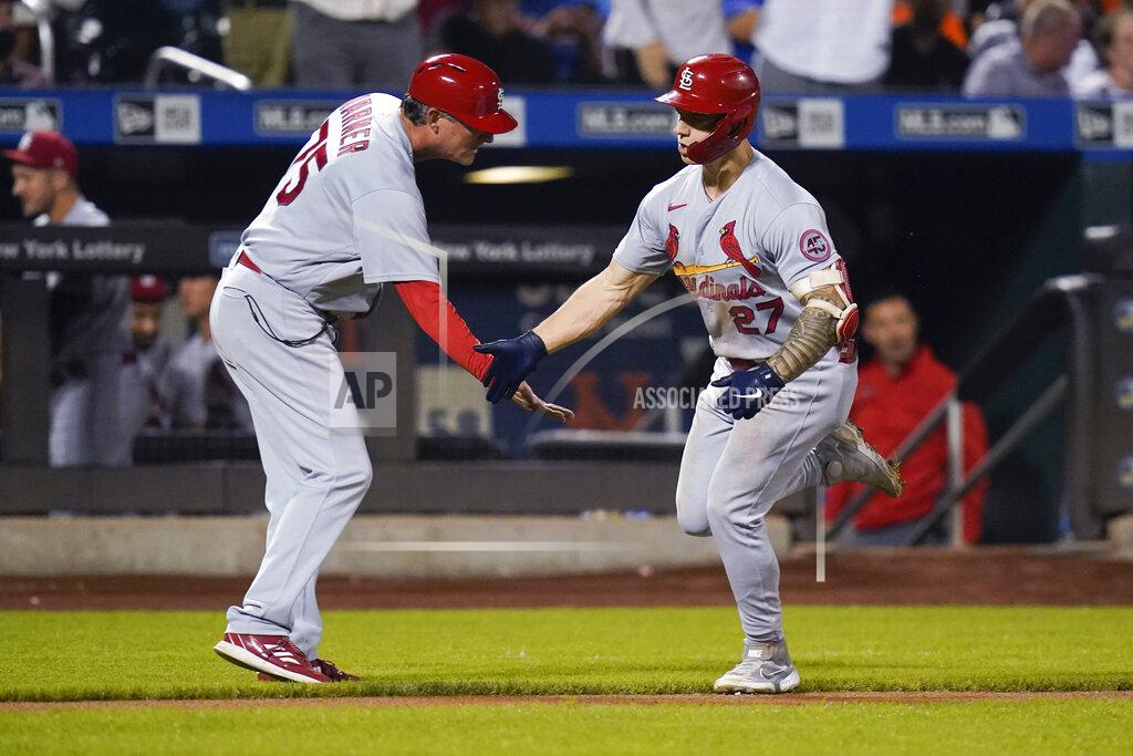 Frank Franklin Ii St. Louis Cardinals third base coach Ron "Pop" Warner celebrates with Tyler O'Neill, right, after O'Neill hit a two-run home run during the eighth inning of the team's baseball game against the New York Mets on Tuesday, Sept. 14, 2021, in New York. (AP Photo/Frank Franklin II)