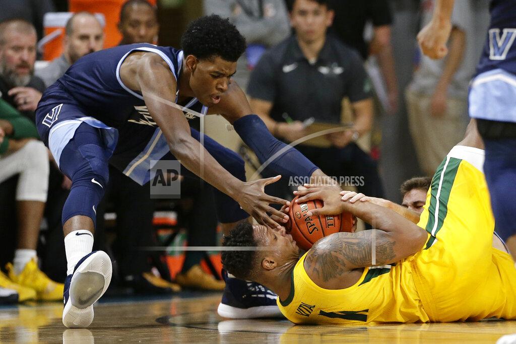 Gerry Broome Villanova forward Brandon Slater reaches for the ball while Baylor guard Mark Vital (11) falls to the floor during the first half of an NCAA college basketball championship game at the Myrtle Beach Invitational in Conway, S.C., Sunday, Nov. 24, 2019. (AP Photo/Gerry Broome)