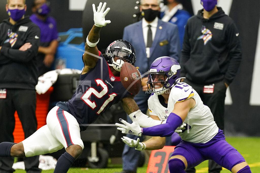David J. Phillip Houston Texans cornerback Bradley Roby (21) breaks up a pass intended for Minnesota Vikings wide receiver Adam Thielen (19) during the second half of an NFL football game Sunday, Oct. 4, 2020, in Houston. (AP Photo/David J. Phillip)