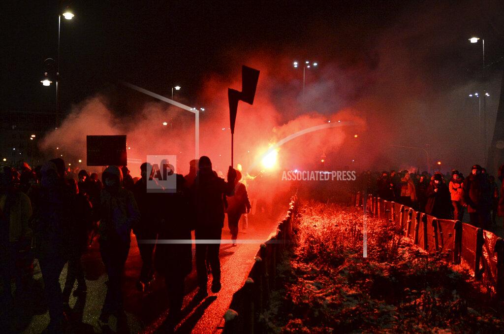 Czarek Sokolowski People gather during a protest against a new anti-abortion law in Warsaw, Poland, Thursday, Jan. 28, 2021. A near-total ban on abortion has taken effect in Poland three months after a top court ruled that the abortion of congenitally damaged fetuses is unconstitutional. Led by a women’s rights group, people poured onto the streets of Warsaw and other cities for the second evening in a row on Thursday to protest the move. (AP Photo/Czarek Sokolowski)