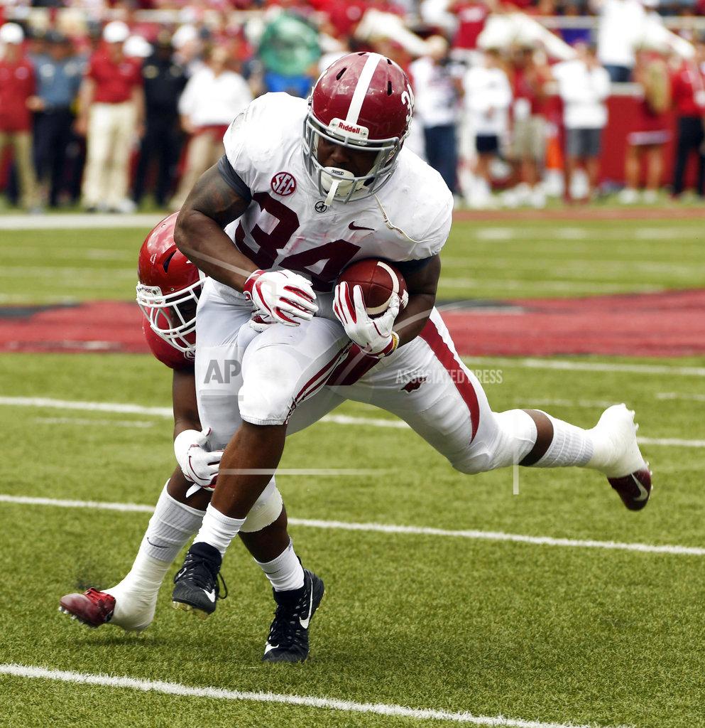 Michael Woods Alabama running back Damien Harris is tackled by Arkansas defender Dre Greenlaw in the second half of an NCAA college football game Saturday, Oct. 6, 2018, in Fayetteville, Ark. (AP Photo/Michael Woods)