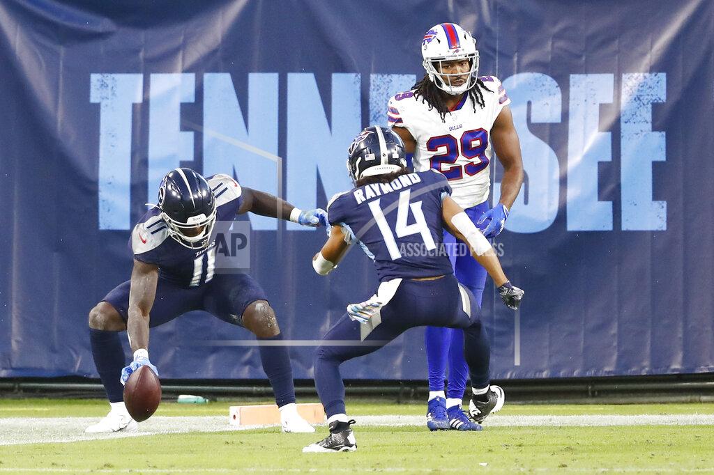 Wade Payne Tennessee Titans wide receiver A.J. Brown (11) celebrates with wide receiver Kalif Raymond (14) after Brown caught a touchdown pass against the Buffalo Bills in the first half of an NFL football game Tuesday, Oct. 13, 2020, in Nashville, Tenn. At right is Bills cornerback Josh Norman (29). (AP Photo/Wade Payne)