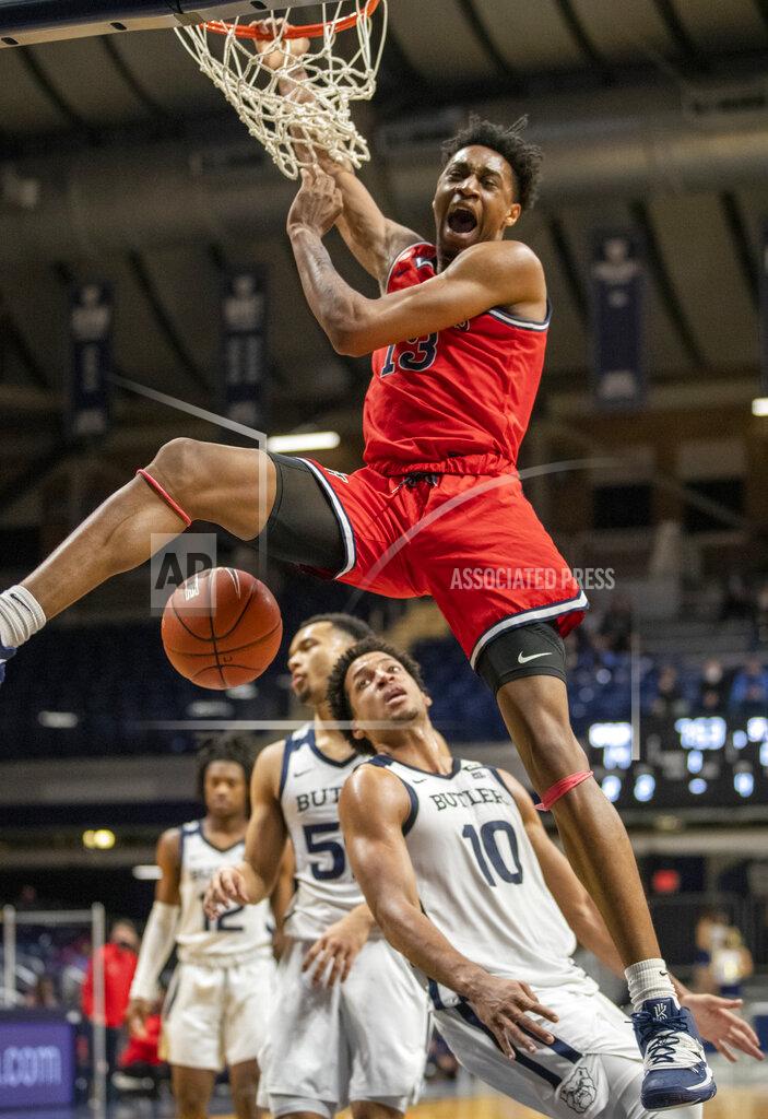 Robert Scheer St. John's forward Isaih Moore (13) throws down a dunk, during an NCAA college basketball game against Butler, Tuesday, Feb. 9, 2021, in Indianapolis. (Robert Scheer/The Indianapolis Star via AP)
