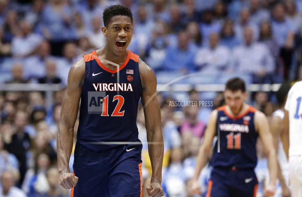 Gerry Broome Virginia's De'Andre Hunter (12) reacts following a win over North Carolina following an NCAA college basketball game in Chapel Hill, N.C., Monday, Feb. 11, 2019. (AP Photo/Gerry Broome)