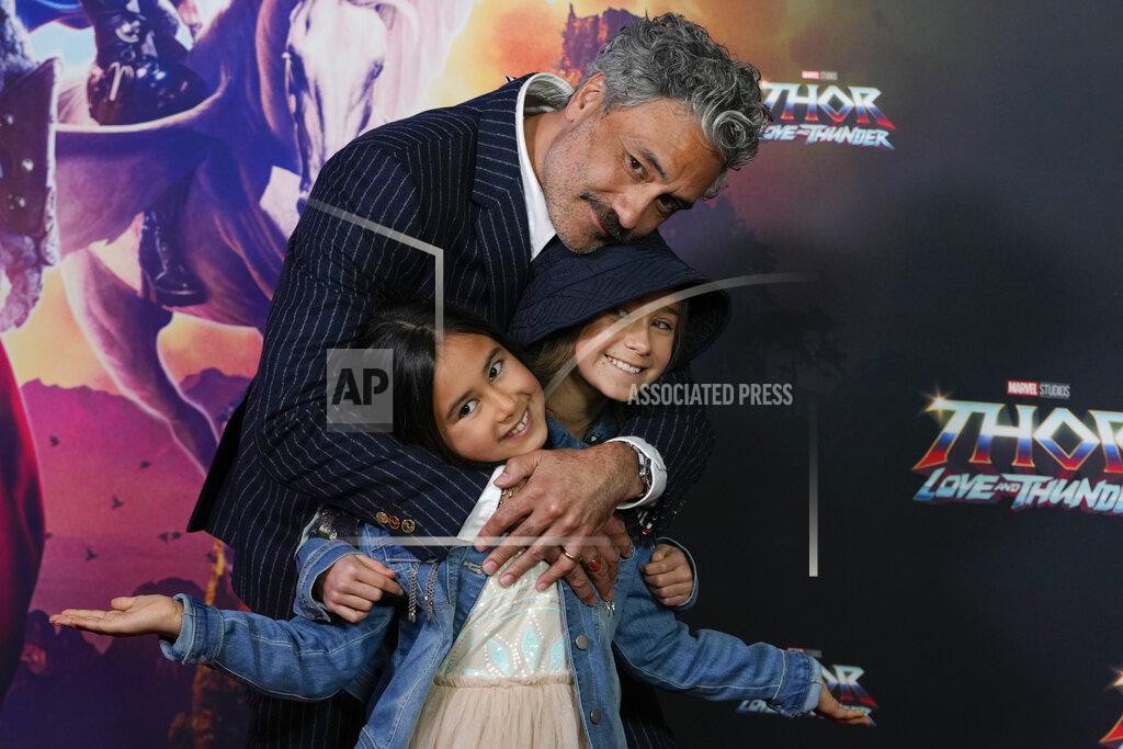Mark Baker New Zealand director Taika Waititi poses for a photo with his daughter's Matewa Kiritapu and Te Hinekahu during a red carpet event for the movie premiere of "Thor: Love and Thunder" at the Entertainment Quarter in Sydney,Australia, Monday, June 27, 2022.(AP Photo/Mark Baker)
