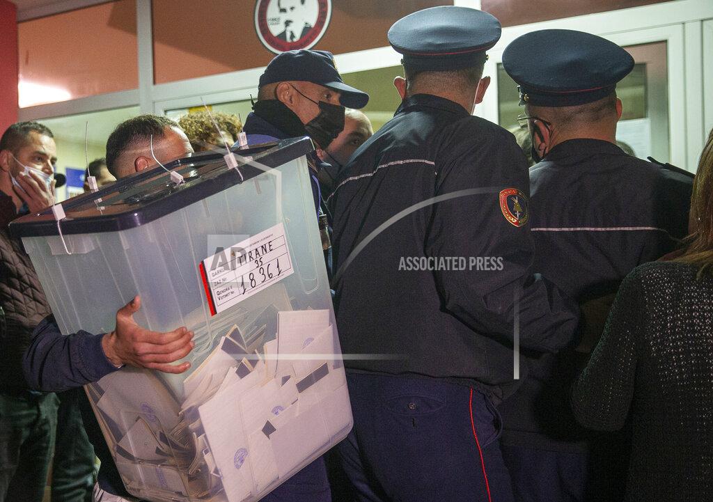 Visar Kryeziu An election official carries a ballot box to a counting center during parliamentary elections in capital Tirana, Albania on Sunday, April 25, 2021. Albanian voters have started casting ballots in parliamentary elections on Sunday amid the virus pandemic and a bitter political rivalry between the country's two largest political parties. (AP Photo/Visar Kryeziu)
